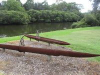 A sculpture of two nawi/canoes beside the Parramatta River.