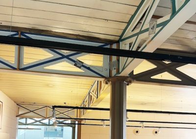 A portable building's exposed ceiling beams.