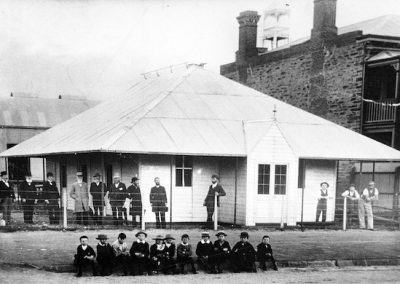 A black and white photograph of a portable building.