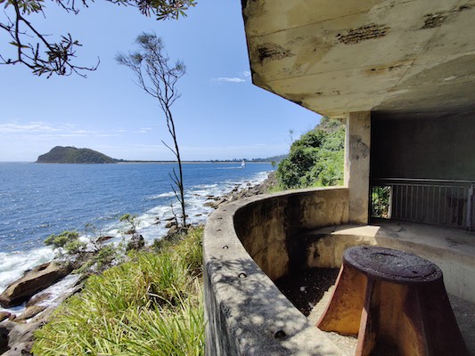 A concrete bunker with a view of the coastline